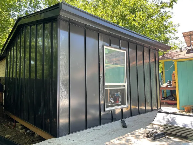 Black standing seam metal wall panels for Roof Inspection in Forest Acres
