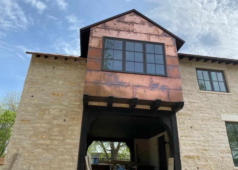 Copper metal panel facade on a stone building for Metal Roof Coating in Forest Acres